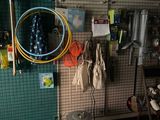 an image of a garage with a lot of tools on the wall