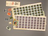 a lot of stamps and stamps on a table