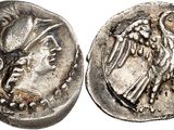 a silver coin with an image of a bird on it