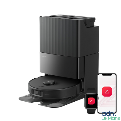 a black coffee maker with a smart phone next to it