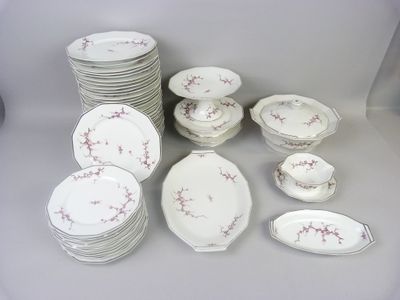 a lot of plates and bowls that are sitting on a table