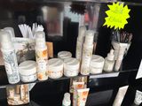 many different types of skin care products displayed on a shelf