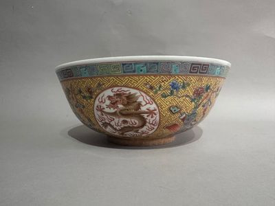 a bowl with a design on it sitting on a table