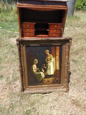 une photo d'un tableau posé par terre dans l'herbe