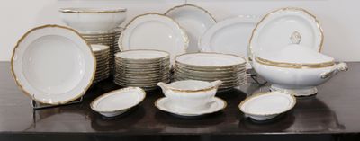 a lot of plates and bowls on the table