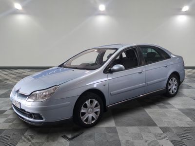 a picture of a silver car parked on a checkered floor