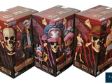 three boxes of one piece action figures are stacked on top of each other
