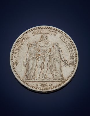 a close up of a coin on a blue background