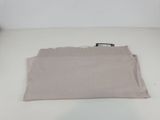 a close up of a piece of cloth on a white surface