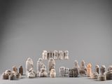 an image of a group of figurines sitting on top of a table