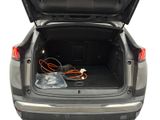 a trunk of a car with an electrical device in it