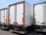 many trucks that are lined up in the parking lot