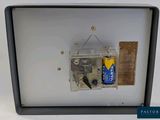 a picture of a small electrical device with a battery attached to it