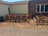 a lot of wooden structures in front of a building