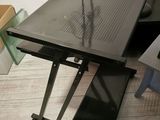 a computer desk with a laptop on top of it
