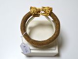 bracelet à imprimé léopard avec un nœud doré