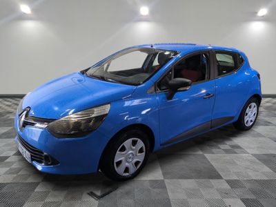 a blue car is parked in a room with a checkered floor