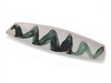 a white plate with a green wave design on it