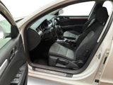 the interior of a car with the door open and the driver ' s seat down