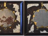 two framed pictures of a sun and a moon on the wall