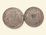 deux pièces d'argent, l'une ornée d'une couronne et l'autre d'un blason