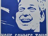 a blue and white poster with a picture of a man laughing