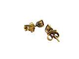 pair of gold tone earrings with garnets and a purple stone