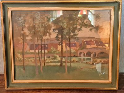 painting of a farm scene in a frame on a wooden table