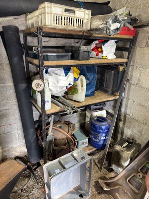 a room with a bunch of items on the shelves