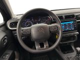 the interior of a car with a steering wheel and dashboard controls