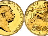a close up of a gold coin with a woman on it