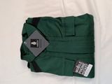 a green pants with a tag on it laying on a bed