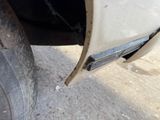 a close up of a car tire with a chain on it