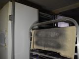 a metal rack with a towel hanging from it ' s side