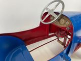 a blue and red toy car with a steering wheel