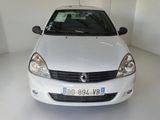 a picture of a white car parked in a garage