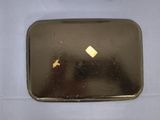 a small mirror with a diamond on it on a table