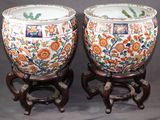 two vases that have been decorated with flowers on them