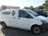 a white van that is parked in a parking lot