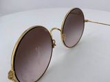 a close up of a pair of sunglasses on a white surface