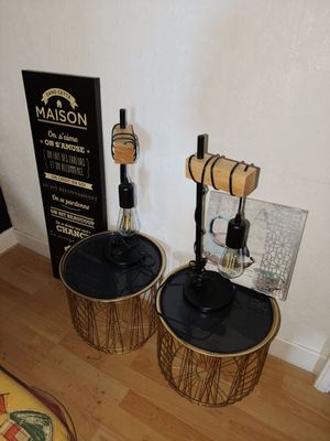 two wooden barrels sitting on the floor next to each other