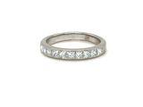 a white gold wedding band with princess cut diamonds