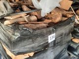 a large pile of wood in a warehouse with a sign on it
