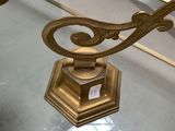 a glass table with a lamp on top of it