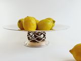 a plate with lemons on it next to a bowl of lemons