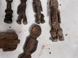 a lot of wooden figurines that are on the table