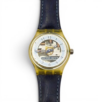 a close up of a watch on a white surface