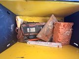 a yellow box with a bunch of items inside of it
