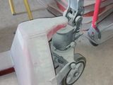 a machine that is sitting on the ground in the garage