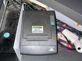a printer sitting on top of a desk next to a printer